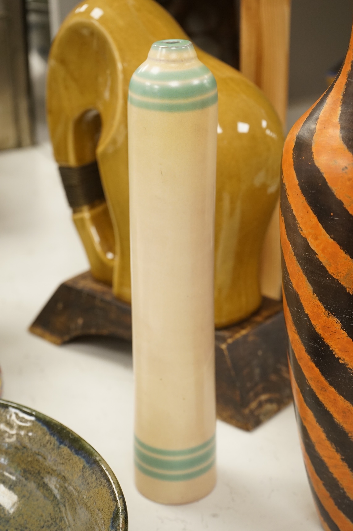 A collection of ceramics to include a Poole turquoise vase, modernist elephant and Santo Stefano di Camastra vase, largest 37cm high